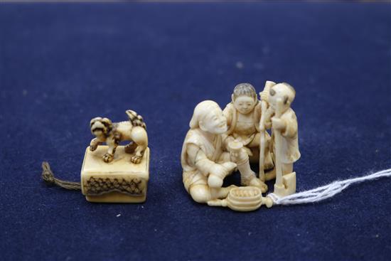 Four Japanese ivory netsuke, an okimono, an octopus and rats, a shi-shi maiju type netsuke, and two figure groups